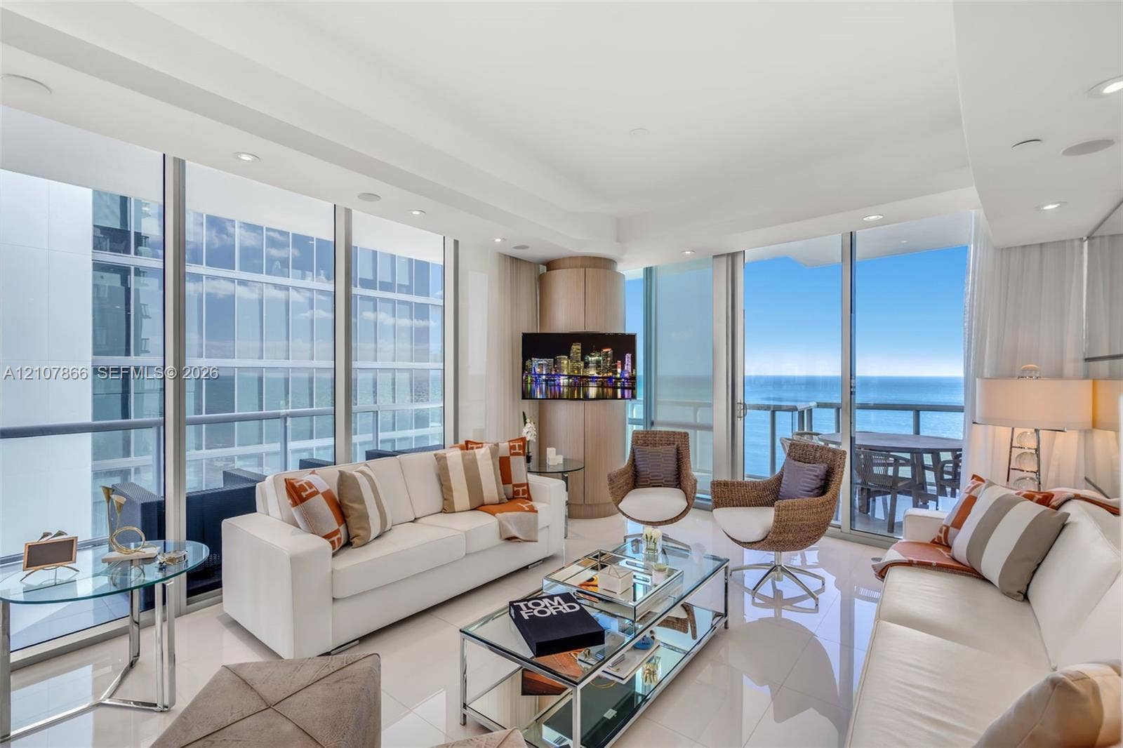 17121 Collins Avenue, #2608, Sunny Isles Beach, FL 33160 Floor-to-ceiling glass walls, polished tile flooring, recessed lighting, and a wrap-around balcony with ocean scenery