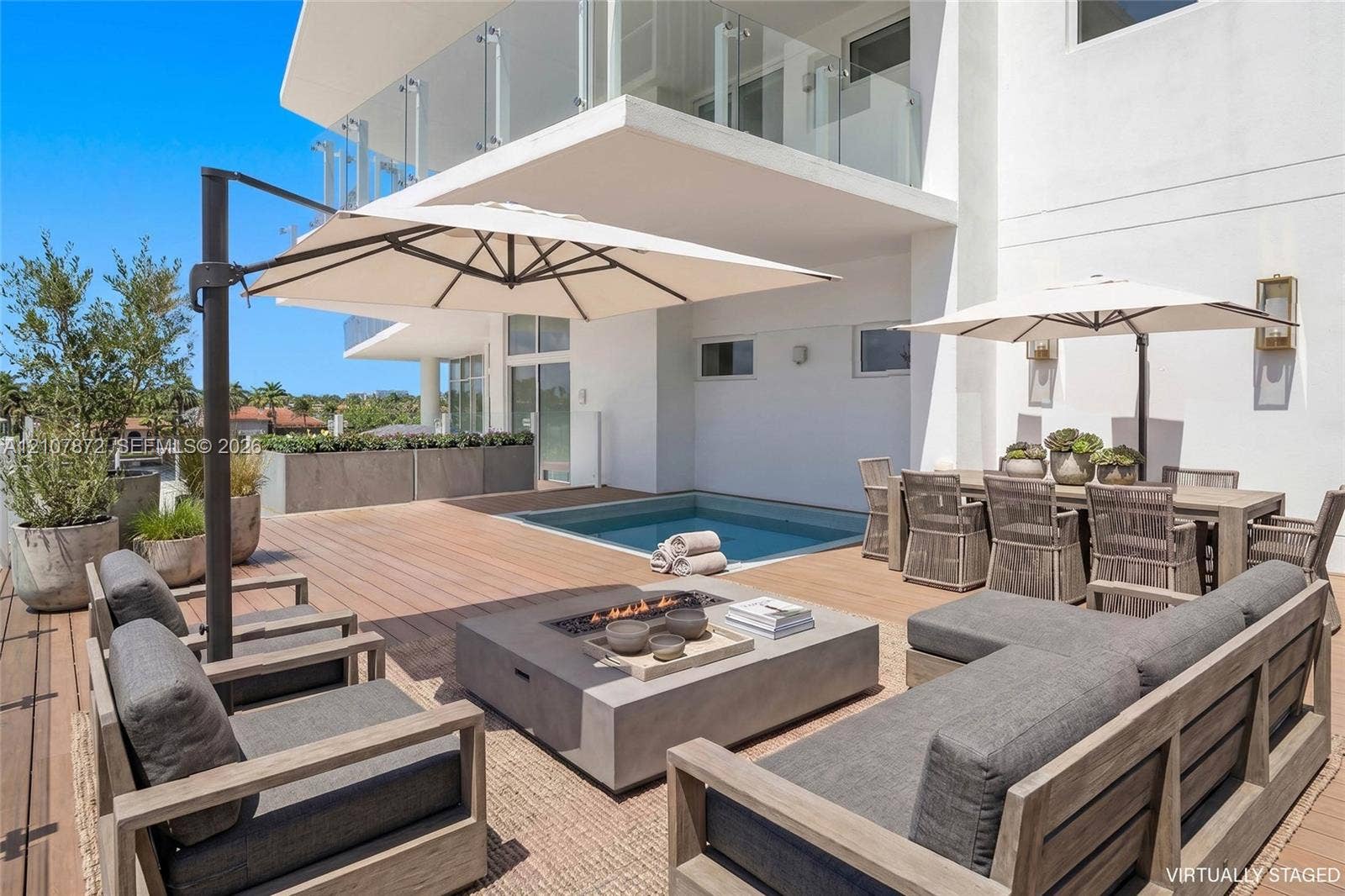 2221 SE 17th Street, #301, Fort Lauderdale, FL 33316 Expansive deck featuring wood-finish flooring, built-in plunge pool, and elevated glass-panel balcony railing