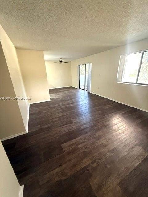 8402 Coral Lake Way, #8402, Coral Springs, Coral Springs, FL 33065 Open-concept living space featuring wood-finish flooring, a ceiling fan, and sliding glass doors