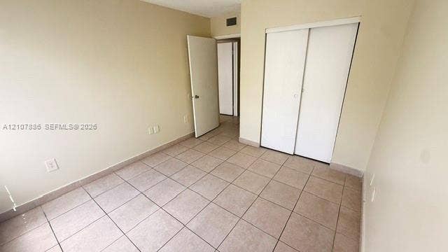 8411 Coral Lake Manor, #8441, Coral Springs, Coral Springs, FL 33065 Neutral-toned ceramic tile flooring, sliding closet doors, and solid-core interior doors