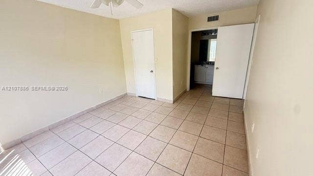 8411 Coral Lake Manor, #8441, Coral Springs, Coral Springs, FL 33065 Interior room featuring neutral wall paint, tile flooring, and a ceiling fan