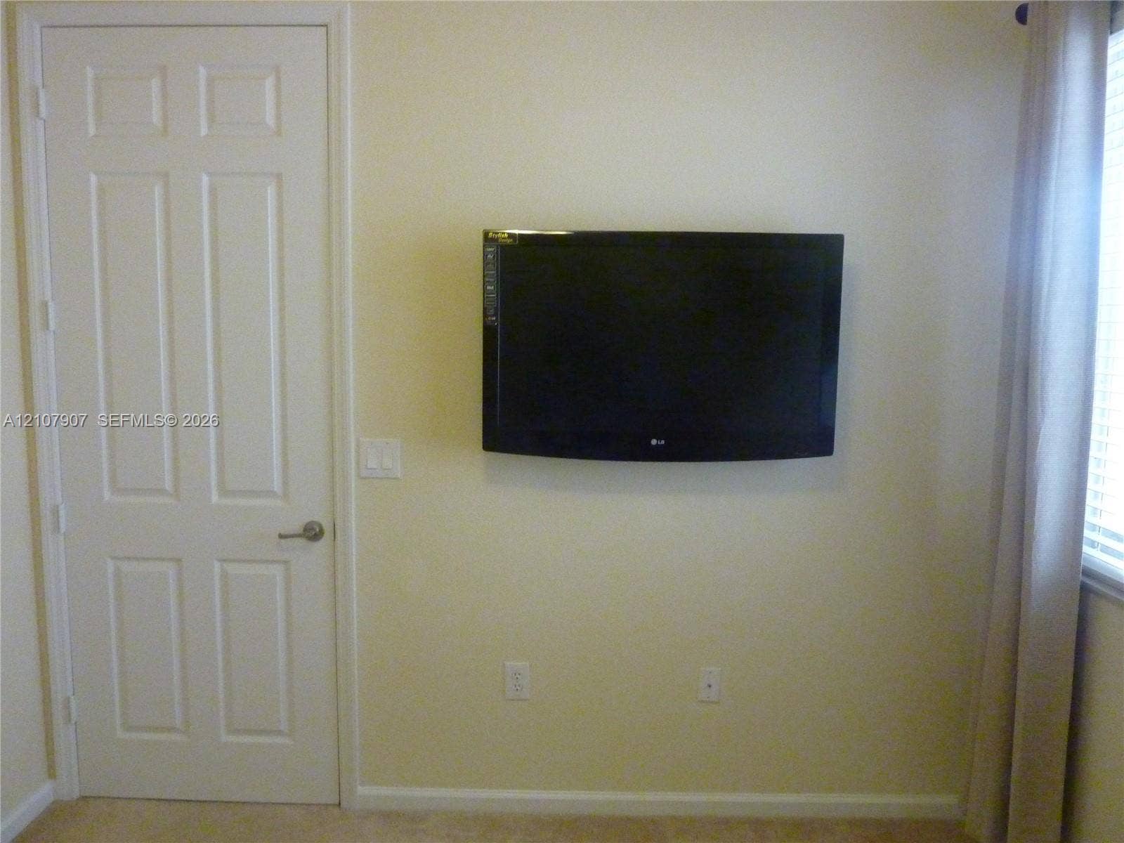 Six-panel interior door with a brushed nickel lever handle