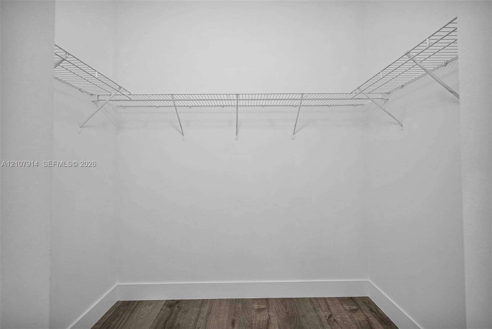 7340 NW 114th Avenue, #205, Doral, FL 33178 Storage area featuring wood-finish flooring and integrated white wire shelving