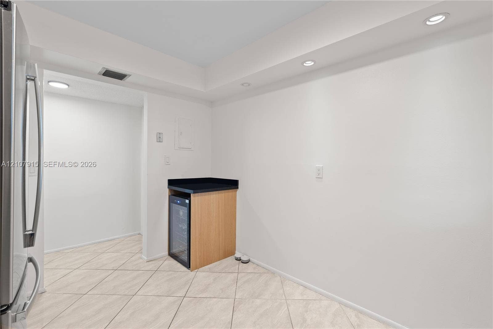 400 Leslie Drive, #622, Hallandale Beach, Hallandale Beach, FL 33009 Built-in cabinetry with a stone countertop, integrated wine cooler, recessed lighting, and tile flooring