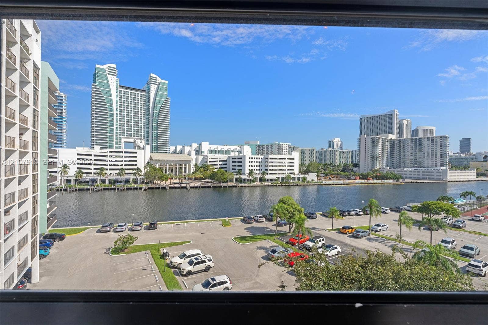400 Leslie Drive, #622, Hallandale Beach, Hallandale Beach, FL 33009 Waterfront perspective featuring high-rise urban architecture and paved parking area