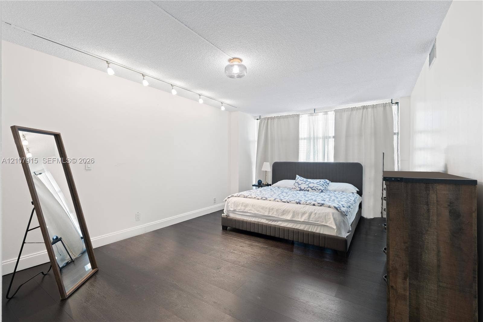 400 Leslie Drive, #622, Hallandale Beach, Hallandale Beach, FL 33009 Interior space featuring dark wood-finish flooring, recessed ceiling lighting, track lighting, and expansive windows