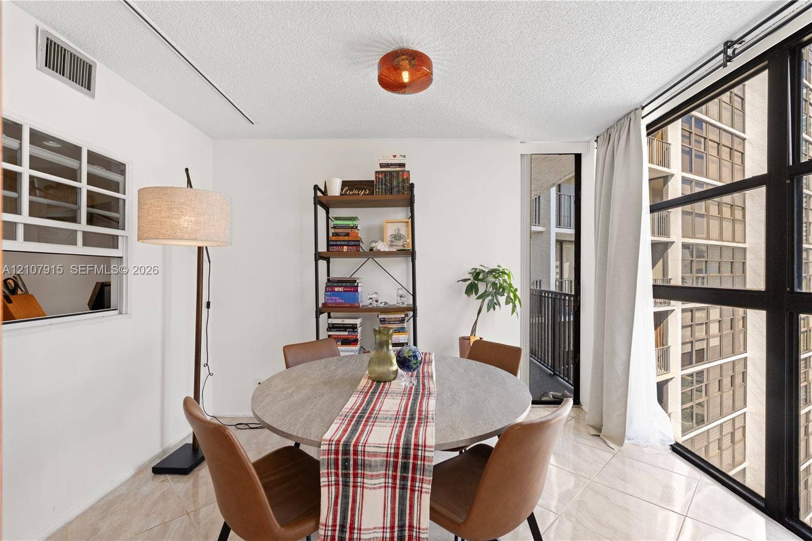 400 Leslie Drive, #622, Hallandale Beach, Hallandale Beach, FL 33009 Large floor-to-ceiling windows with black metal frames, polished tile flooring, glass-paneled interior window, and flush-mount industrial-style lighting fixture