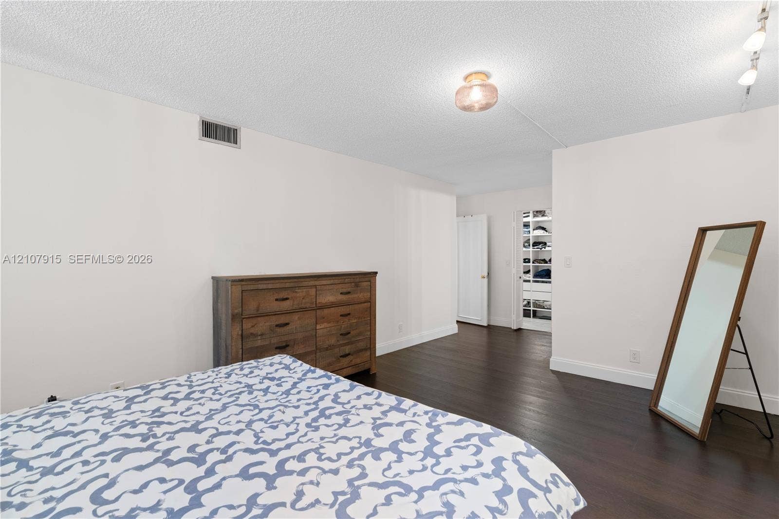 400 Leslie Drive, #622, Hallandale Beach, Hallandale Beach, FL 33009 Dark wood-finish flooring and a walk-in closet featuring built-in shelving