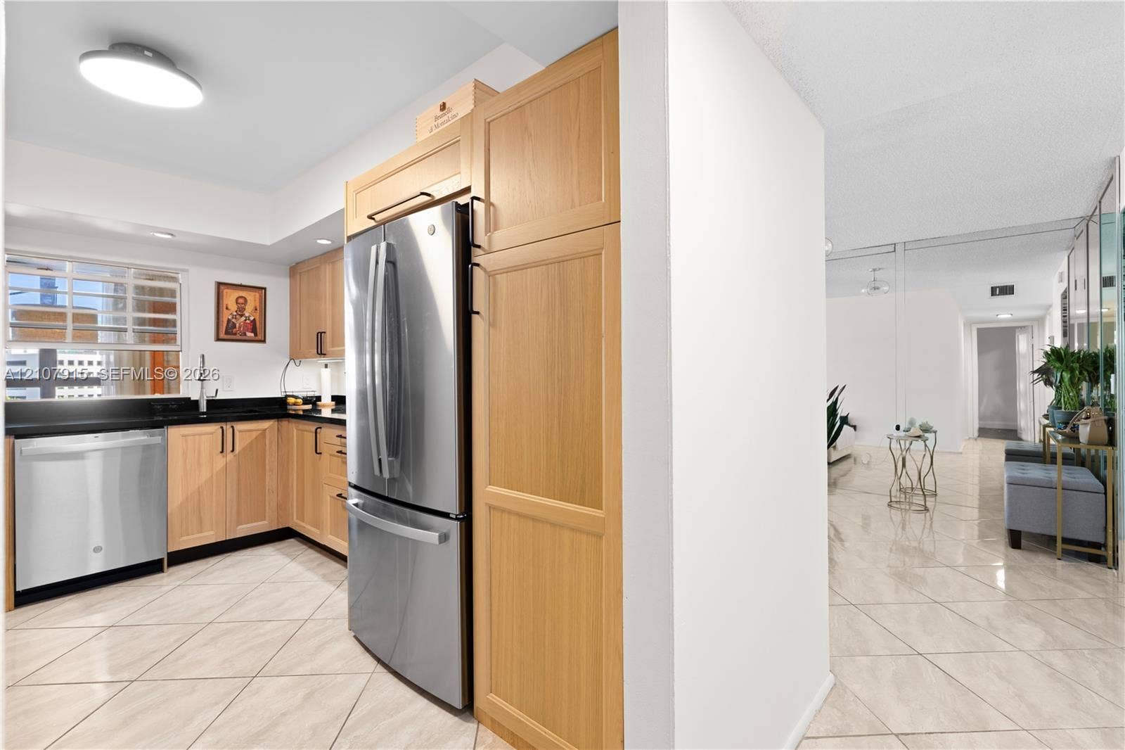 400 Leslie Drive, #622, Hallandale Beach, Hallandale Beach, FL 33009 Kitchen featuring natural wood cabinetry, stainless steel appliances, dark stone countertops, and light-toned tile flooring