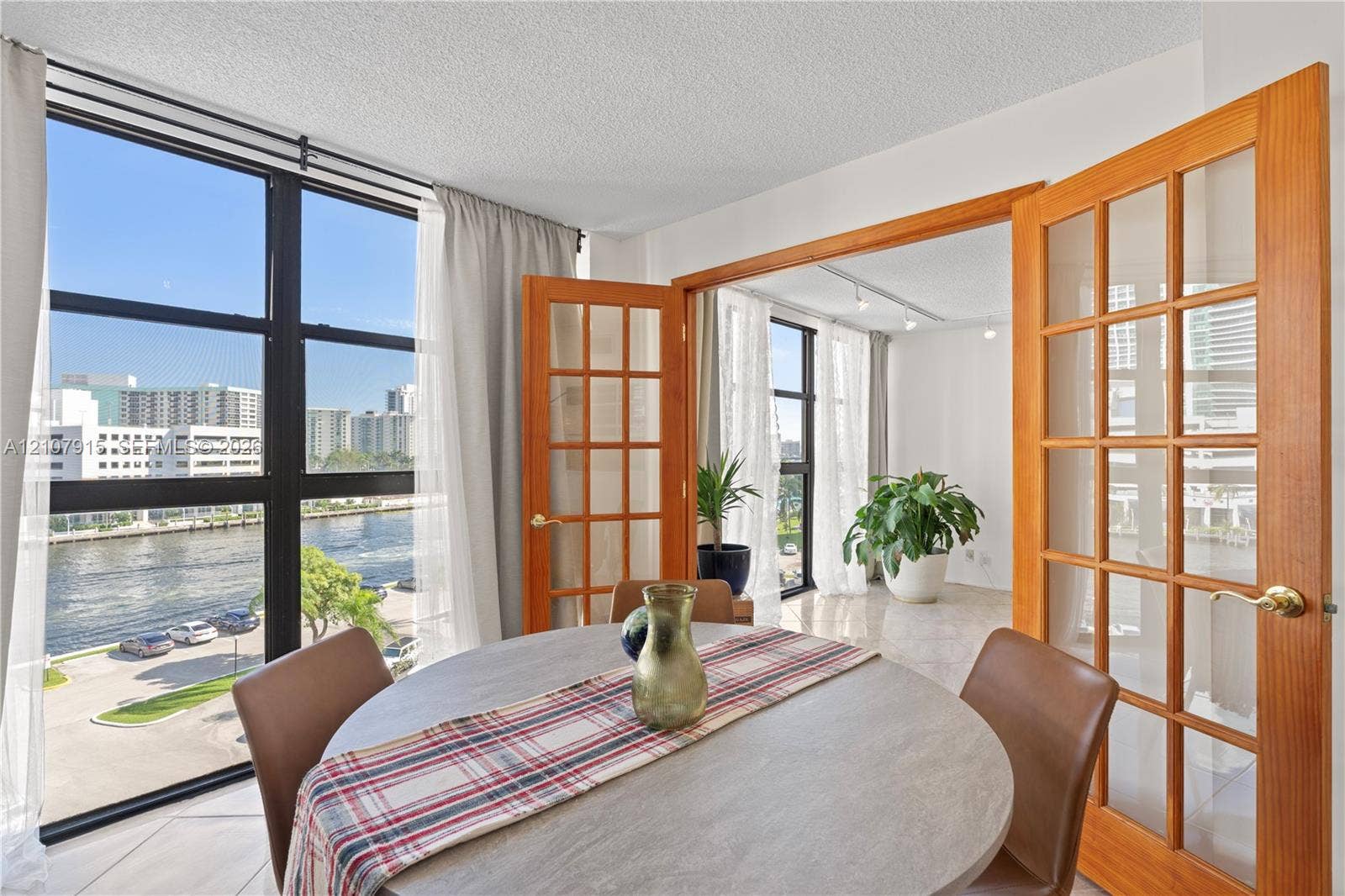 400 Leslie Drive, #622, Hallandale Beach, Hallandale Beach, FL 33009 Floor-to-ceiling windows, wood-framed French doors, polished stone-finish flooring, and water-facing exposure