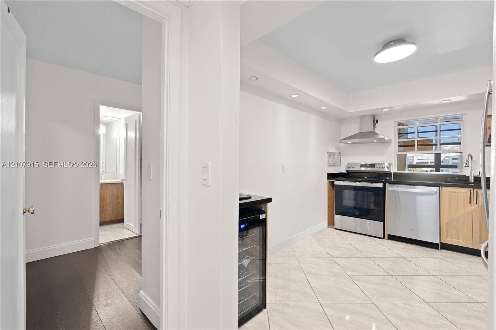 400 Leslie Drive, #622, Hallandale Beach, Hallandale Beach, FL 33009 Kitchen featuring stainless steel appliances, light wood cabinetry, stone countertops, a built-in wine refrigerator, and tile flooring