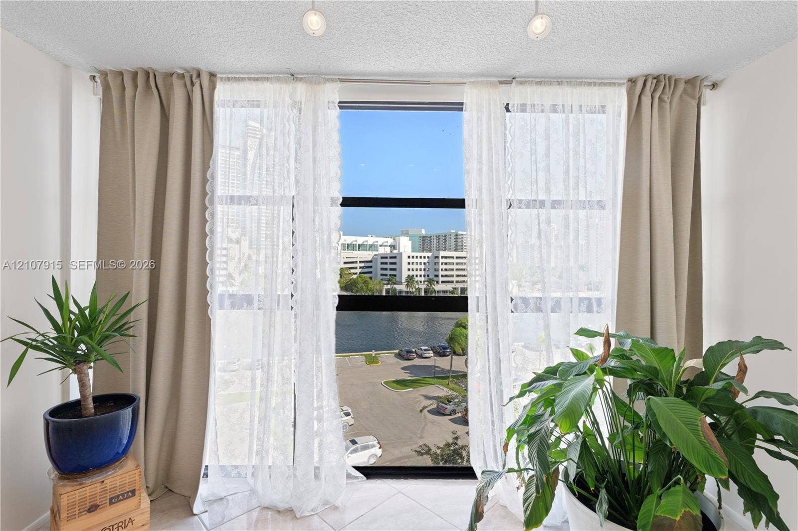 400 Leslie Drive, #622, Hallandale Beach, Hallandale Beach, FL 33009 Floor-to-ceiling windows with black framing, tile flooring, and dual overhead recessed lighting