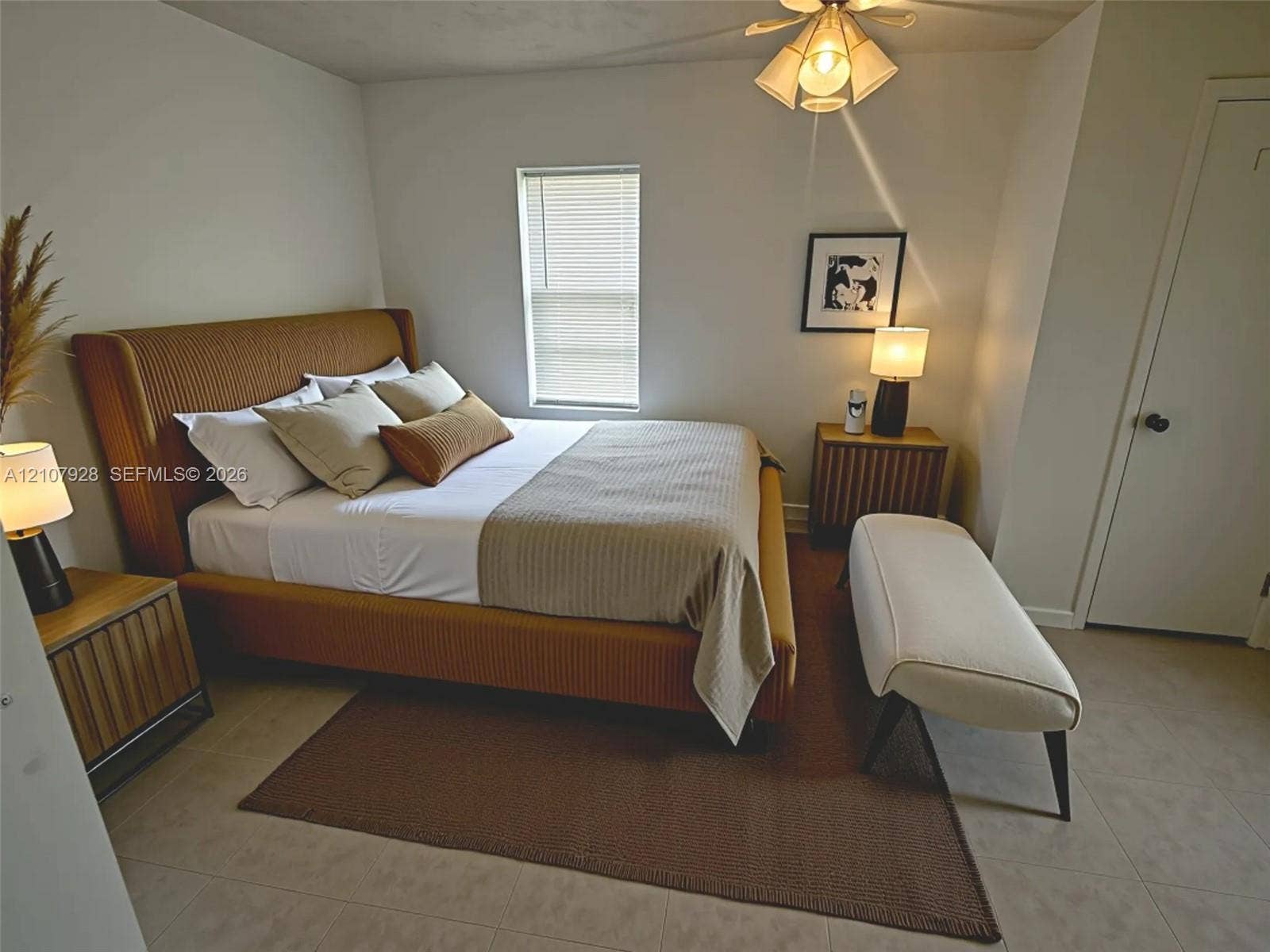 815 Foster Road, #2, Hallandale Beach, Hallandale Beach, FL 33009 Multi-light ceiling fixture, tiled flooring, and neutral wall tones