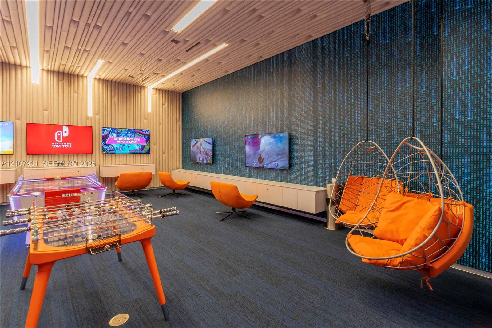 Custom ceiling architecture with integrated linear lighting, custom wall paneling, built-in cabinetry, and patterned accent wall