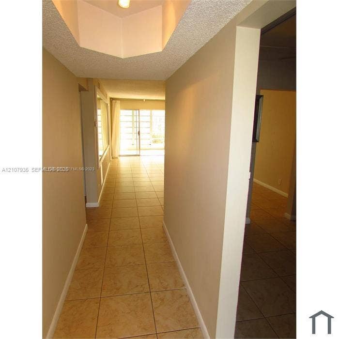 2839 Taylor Street, #3, Hollywood, Hollywood, FL 33020 Ceramic tile flooring, recessed ceiling accent, and sliding glass doors