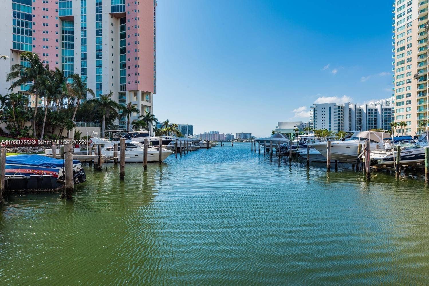 3370 Hidden Bay Drive, #510, Aventura, FL 33180 Waterfront marina featuring deep-water slips, wooden pilings, and direct water access