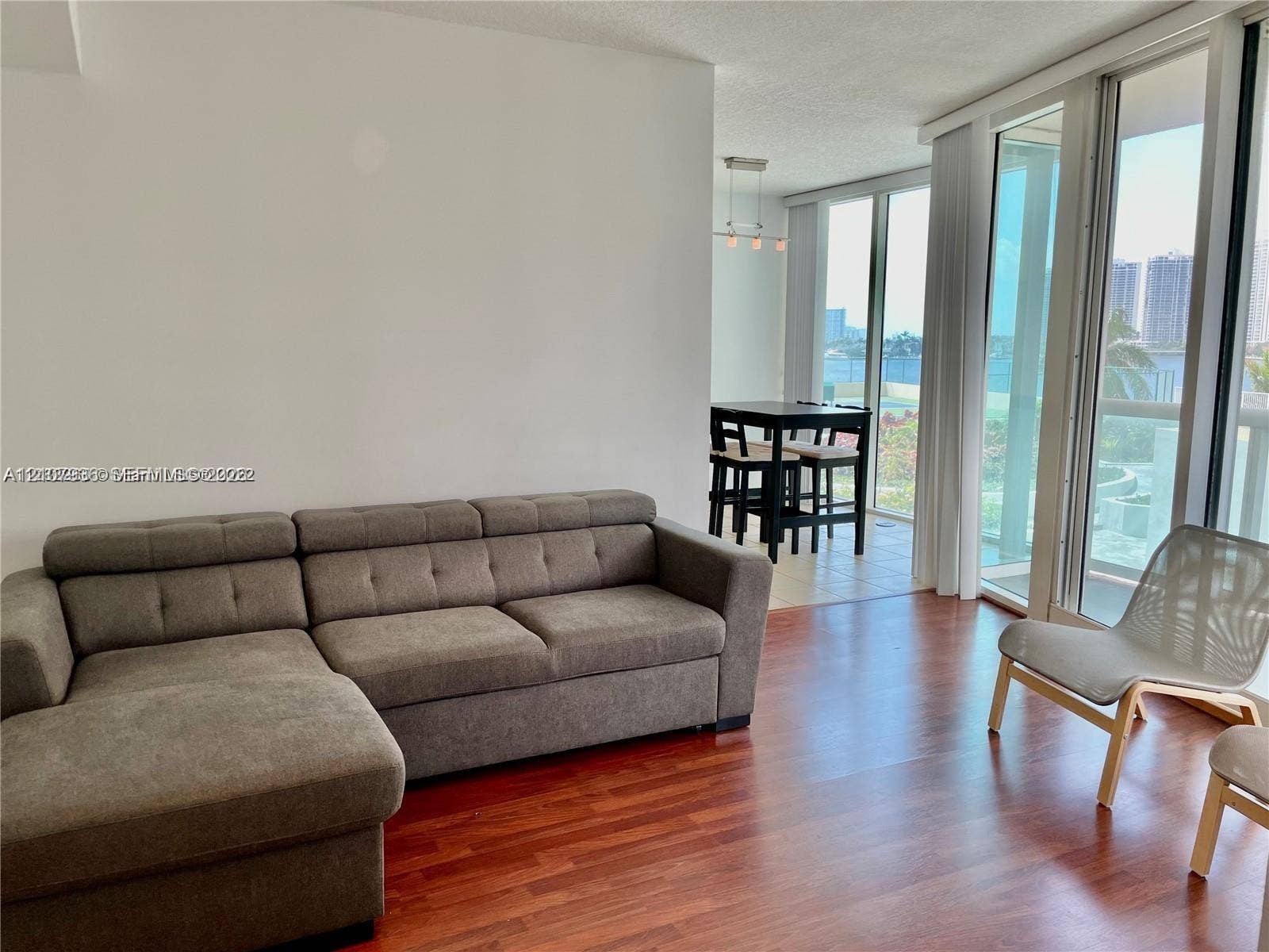 3370 Hidden Bay Drive, #510, Aventura, FL 33180 Floor-to-ceiling windows, wood-finish flooring, and recessed ceiling lighting