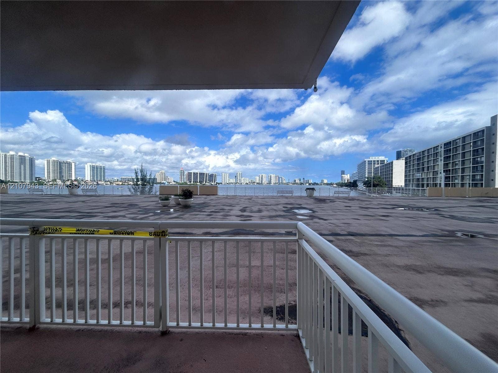 251 174th Street, #201, Sunny Isles Beach, Sunny Isles Beach, FL 33160 Expansive open-air terrace featuring a white metal railing and direct water and city skyline exposure