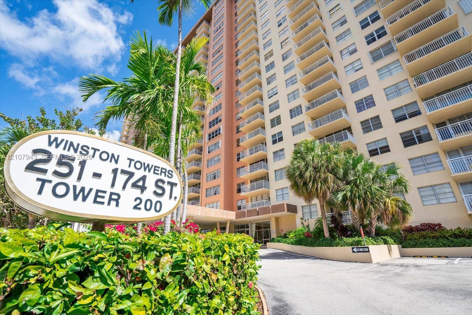 251 174th Street, #201, Sunny Isles Beach, Sunny Isles Beach, FL 33160 High-rise residential exterior featuring private balconies, masonry construction, and established landscaping