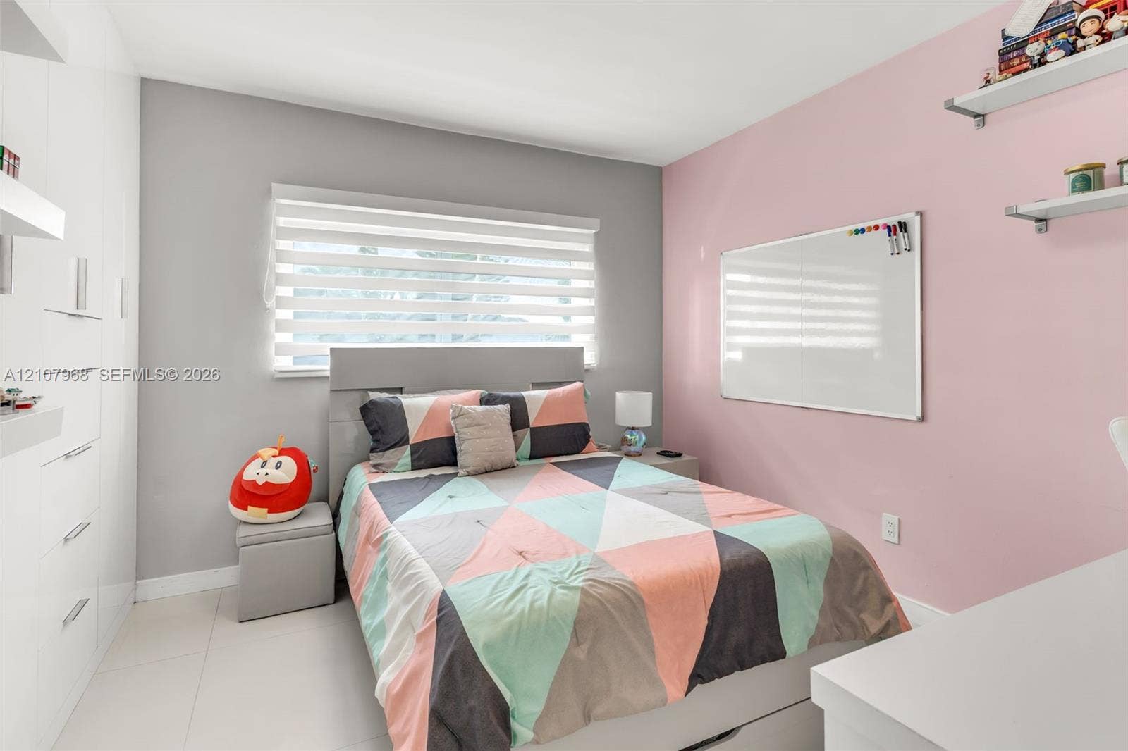 10841 SW 126th Street, Miami, FL 33176 Built-in floor-to-ceiling white cabinetry, layered window blinds, and light-toned tile flooring