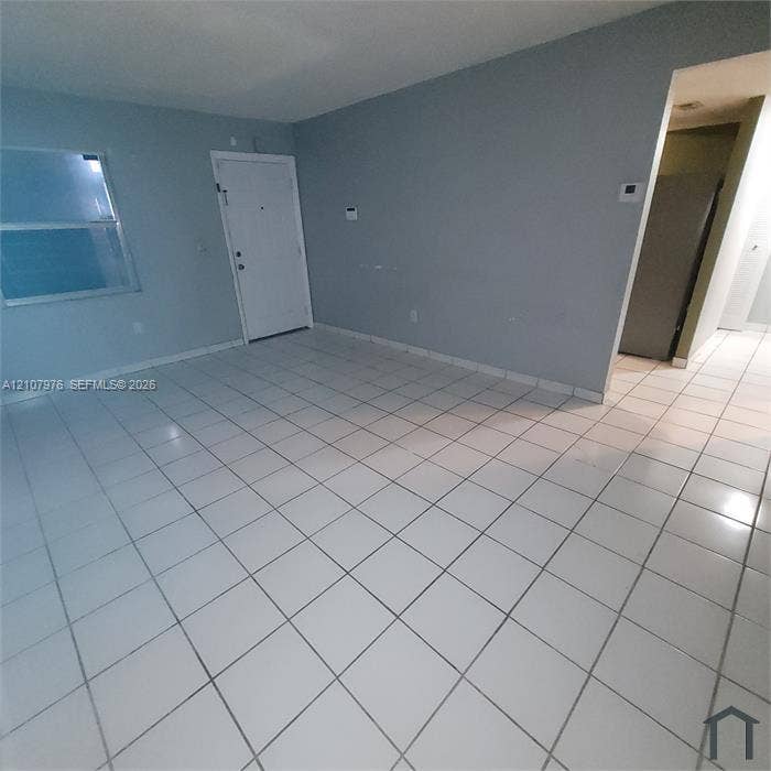5100 SW 41st Street, #101, Hollywood, Hollywood, FL 33023 Neutral-toned walls paired with large-format square tile flooring