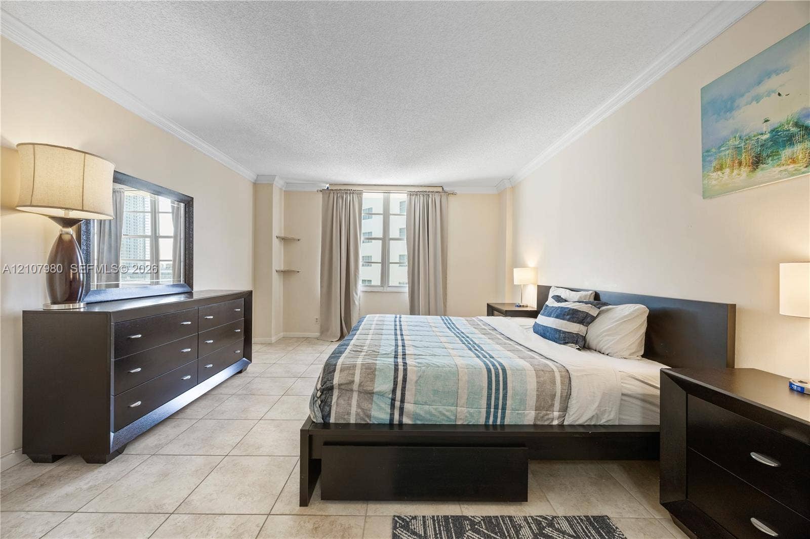 3725 S Ocean Drive, #1120, Hollywood, Hollywood, FL 33019 Tile flooring, crown molding, and dual built-in wall shelves