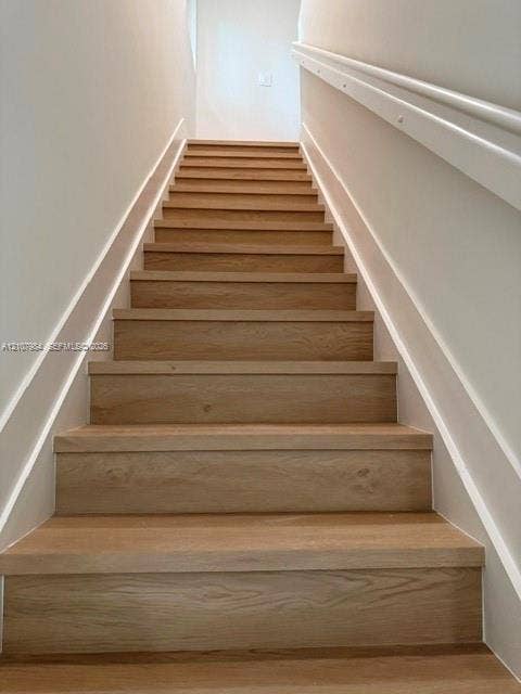 1567 NW 94th Way, #10, Coral Springs, Coral Springs, FL 33071 Staircase featuring wood-finish treads and white painted handrails