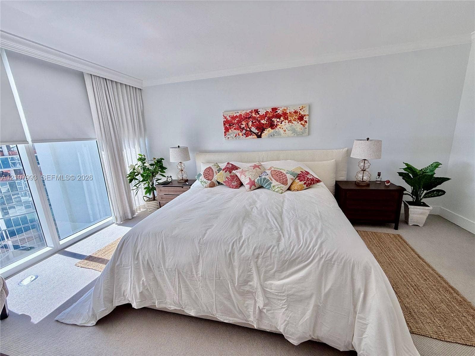 10275 Collins Avenue, #1110, Bal Harbour, Bal Harbour, FL 33154 Floor-to-ceiling windows with neutral drapery, crown molding, and wall-to-wall carpeting