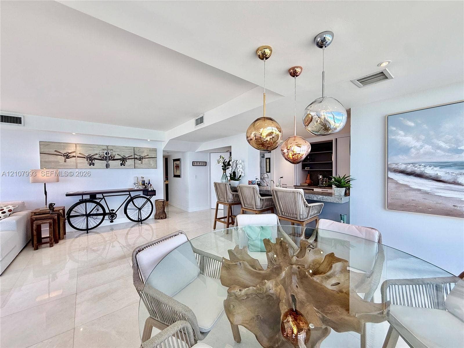 10275 Collins Avenue, #1110, Bal Harbour, Bal Harbour, FL 33154 Polished tile flooring, built-in wet bar with stone countertop, and decorative metallic globe pendant lighting
