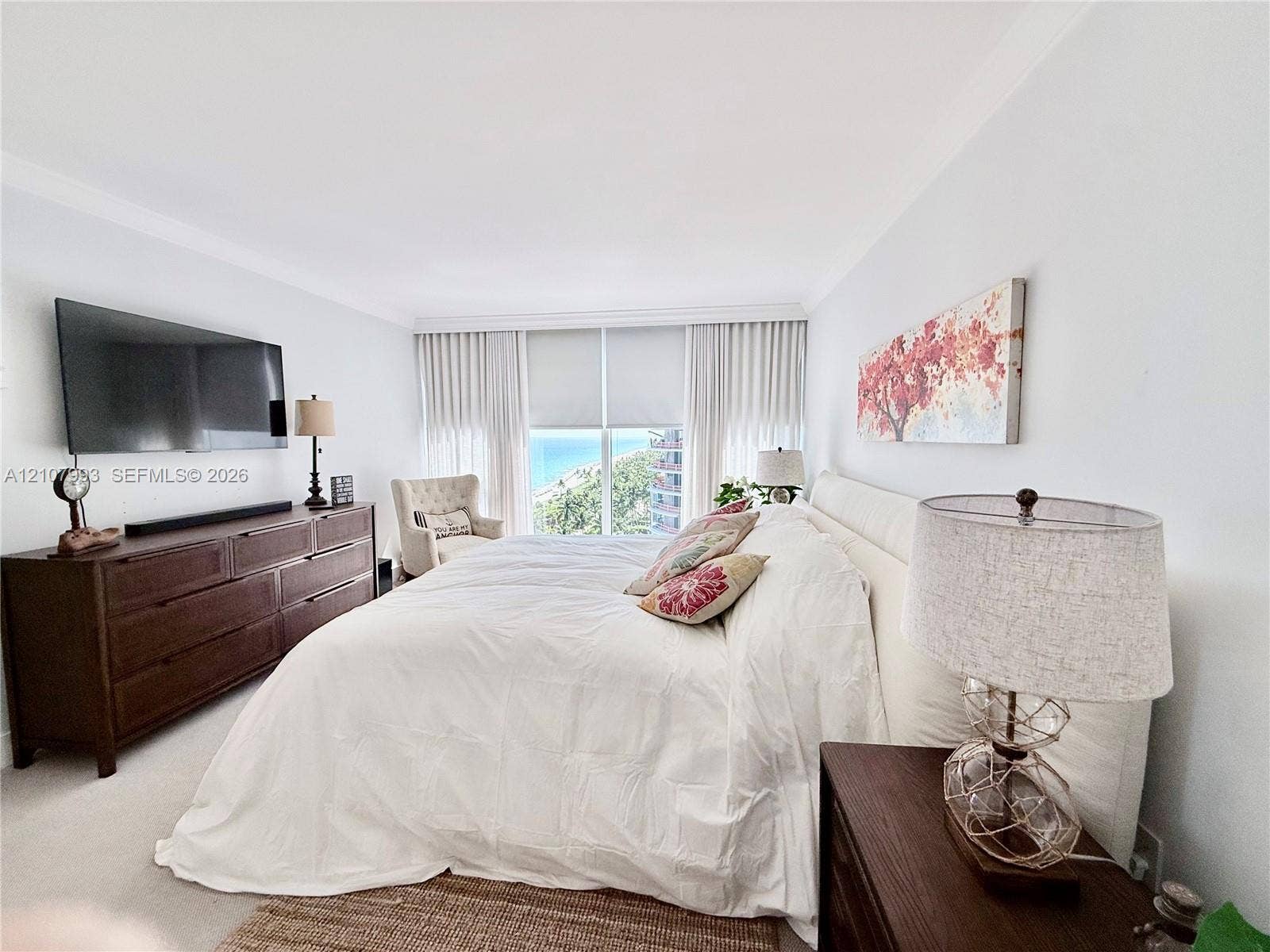 10275 Collins Avenue, #1110, Bal Harbour, Bal Harbour, FL 33154 Expansive floor-to-ceiling windows featuring coastal scenery, wall-to-wall carpeting, and neutral paint palette