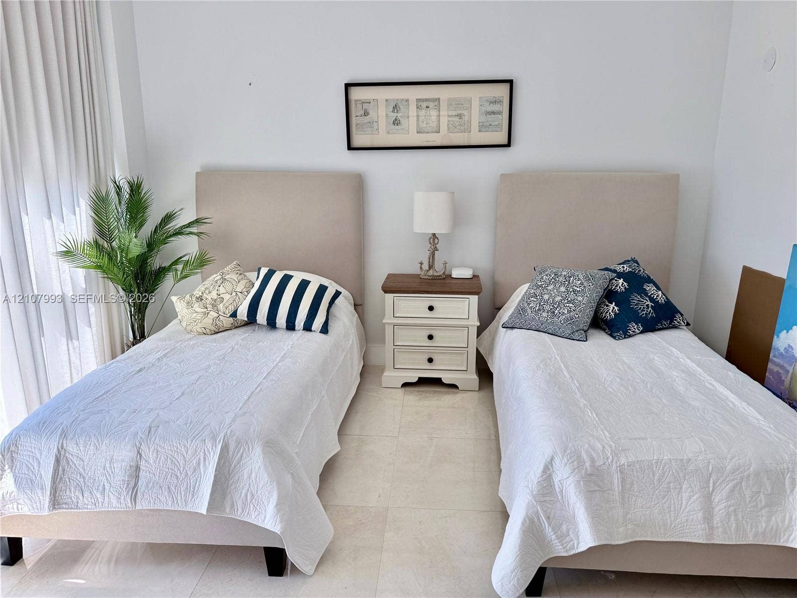 10275 Collins Avenue, #1110, Bal Harbour, Bal Harbour, FL 33154 Neutral-toned stone flooring and floor-to-ceiling drapery