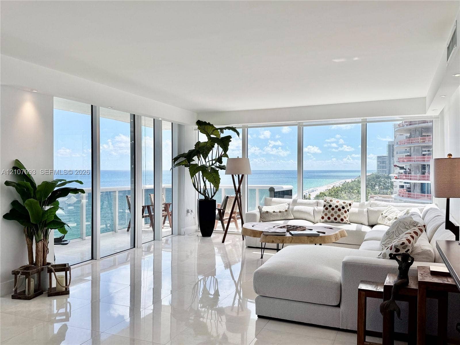 10275 Collins Avenue, #1110, Bal Harbour, Bal Harbour, FL 33154 Floor-to-ceiling windows, white polished tile flooring, recessed lighting, and a glass-railed balcony with ocean and coastline exposure
