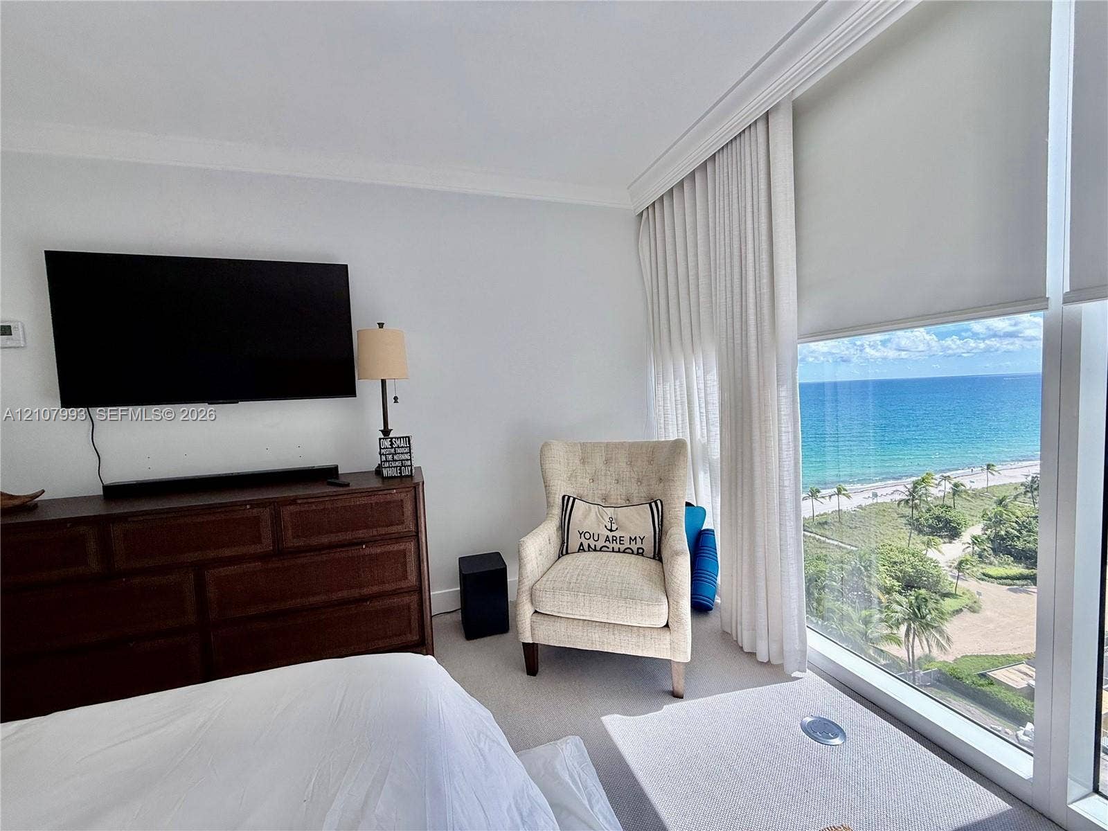 10275 Collins Avenue, #1110, Bal Harbour, Bal Harbour, FL 33154 Floor-to-ceiling windows, neutral carpeting, crown molding, and direct oceanfront scenery
