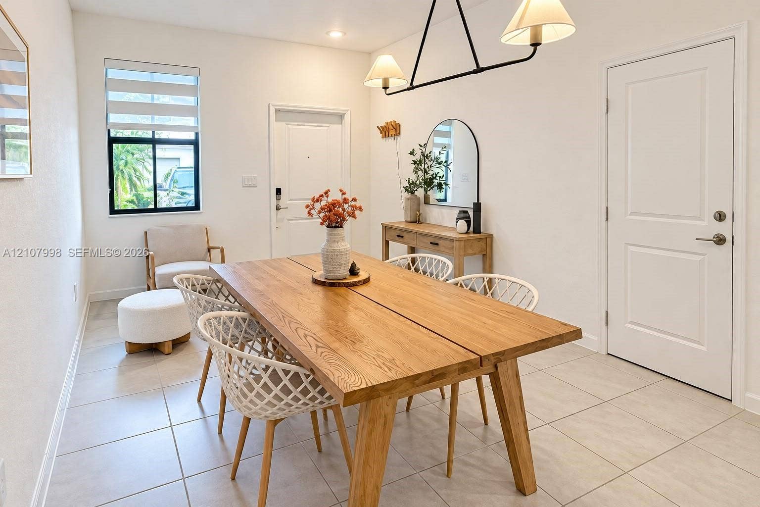 23471 SW 129th Avenue, Homestead, Homestead, FL 33032 Neutral ceramic tile flooring, multi-pane window with integrated shade, recessed lighting, and contemporary dual-shade pendant light fixture