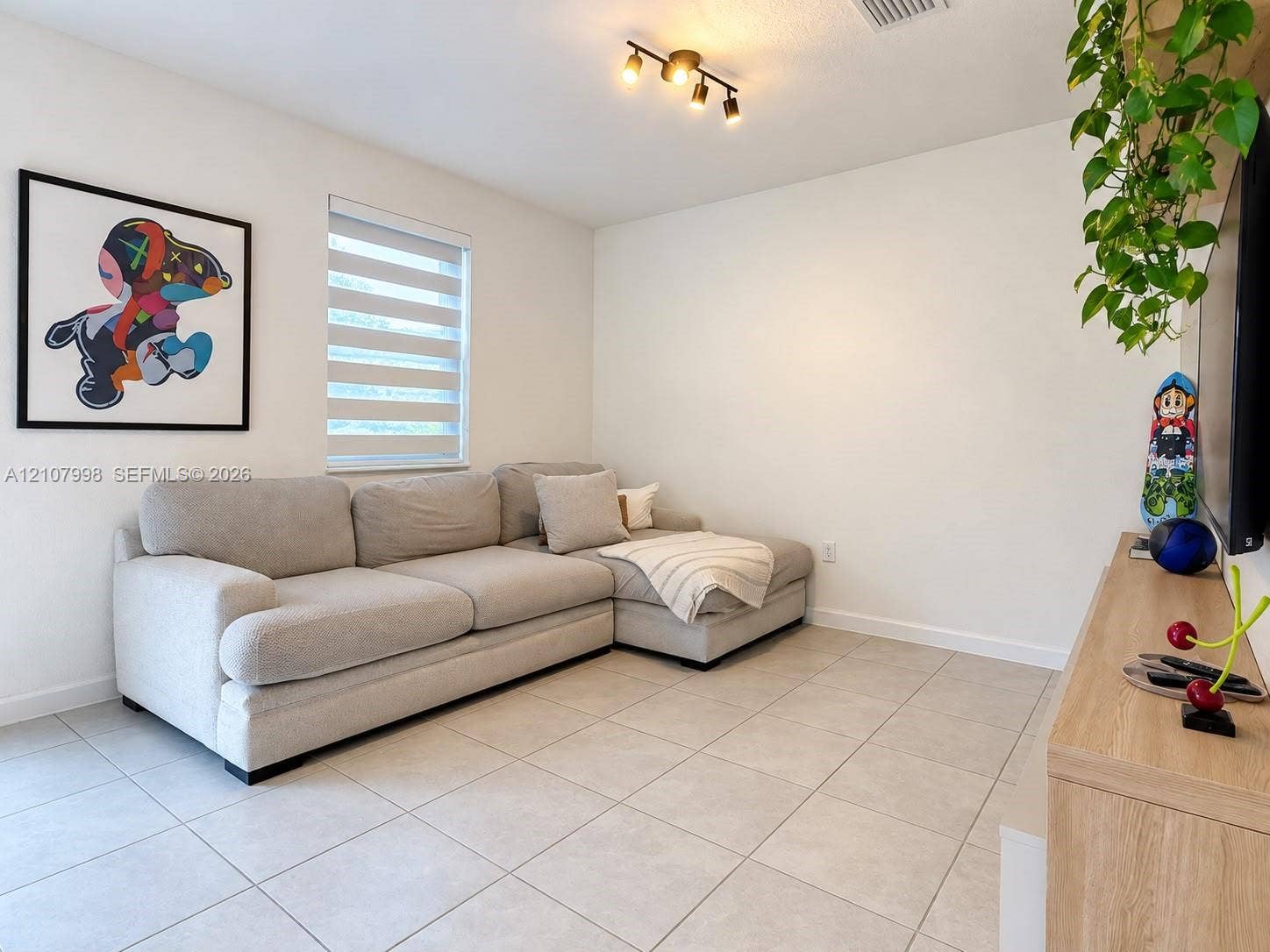 23471 SW 129th Avenue, Homestead, Homestead, FL 33032 Neutral-toned ceramic floor tiling, adjustable dual-shade window treatments, and multi-directional track lighting