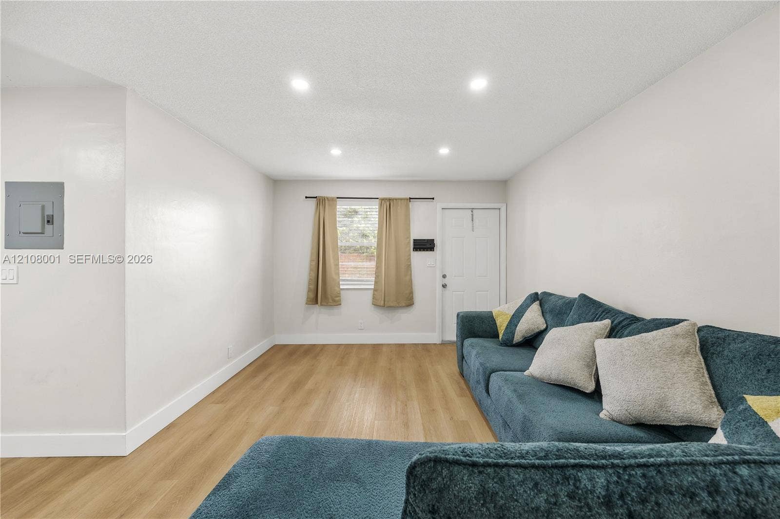 2418 Polk Street, #105, Hollywood, Hollywood, FL 33020 Interior space featuring recessed lighting, wood-finish flooring, and a six-panel entry door