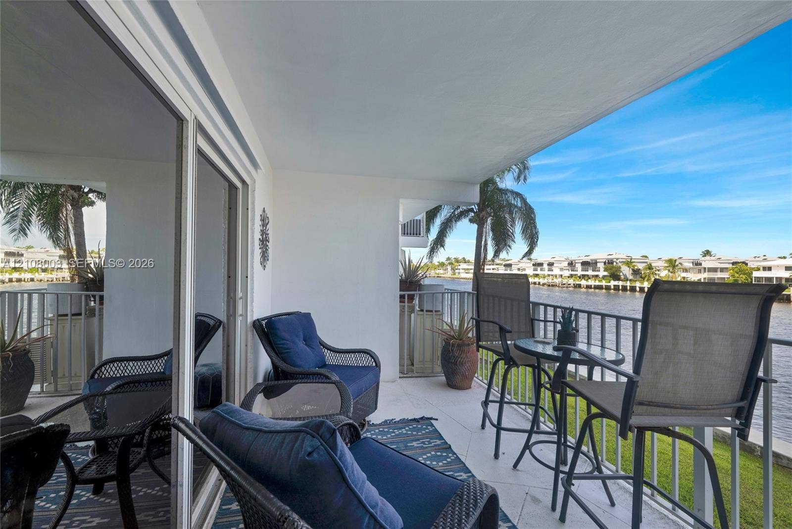 1536 SE 15th Court, #207, Deerfield Beach, FL 33441 Covered balcony featuring tiled flooring, metal railing, and direct water exposure