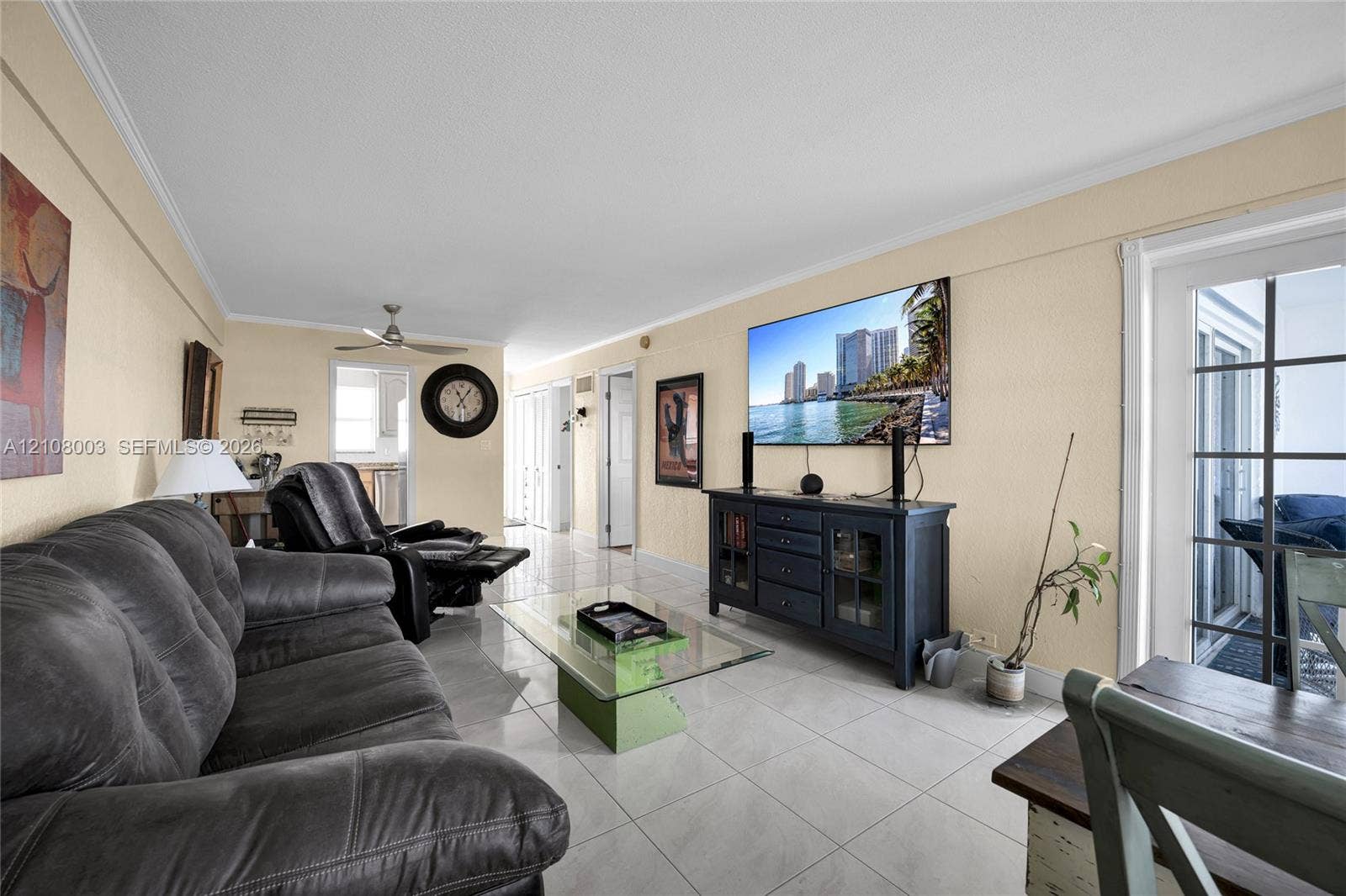 1536 SE 15th Court, #207, Deerfield Beach, FL 33441 Living area featuring light-toned tile flooring, recessed ceiling lighting, a dedicated ceiling fan, and multi-pane glass door paneling
