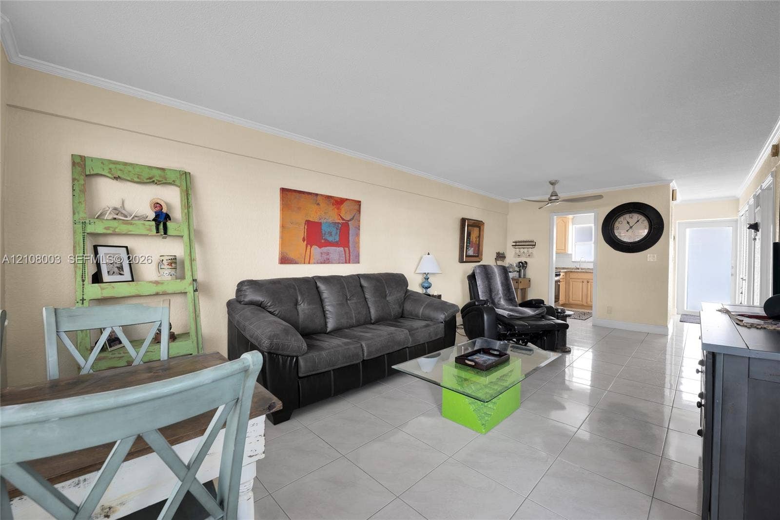 1536 SE 15th Court, #207, Deerfield Beach, FL 33441 Large-format ceramic tile flooring, ceiling fan with light fixture, and recessed entry door