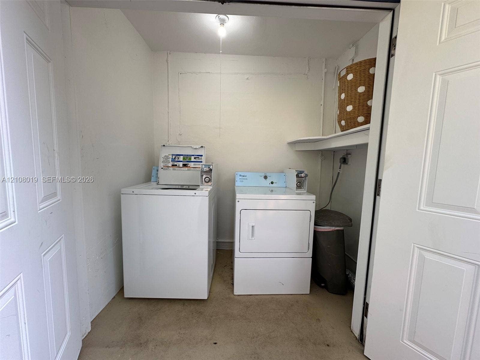 1105 NE 5th Terrace, #1-4, Fort Lauderdale, Fort Lauderdale, FL 33304 Laundry closet featuring dual white-finish laundry appliances and an integrated overhead storage shelf