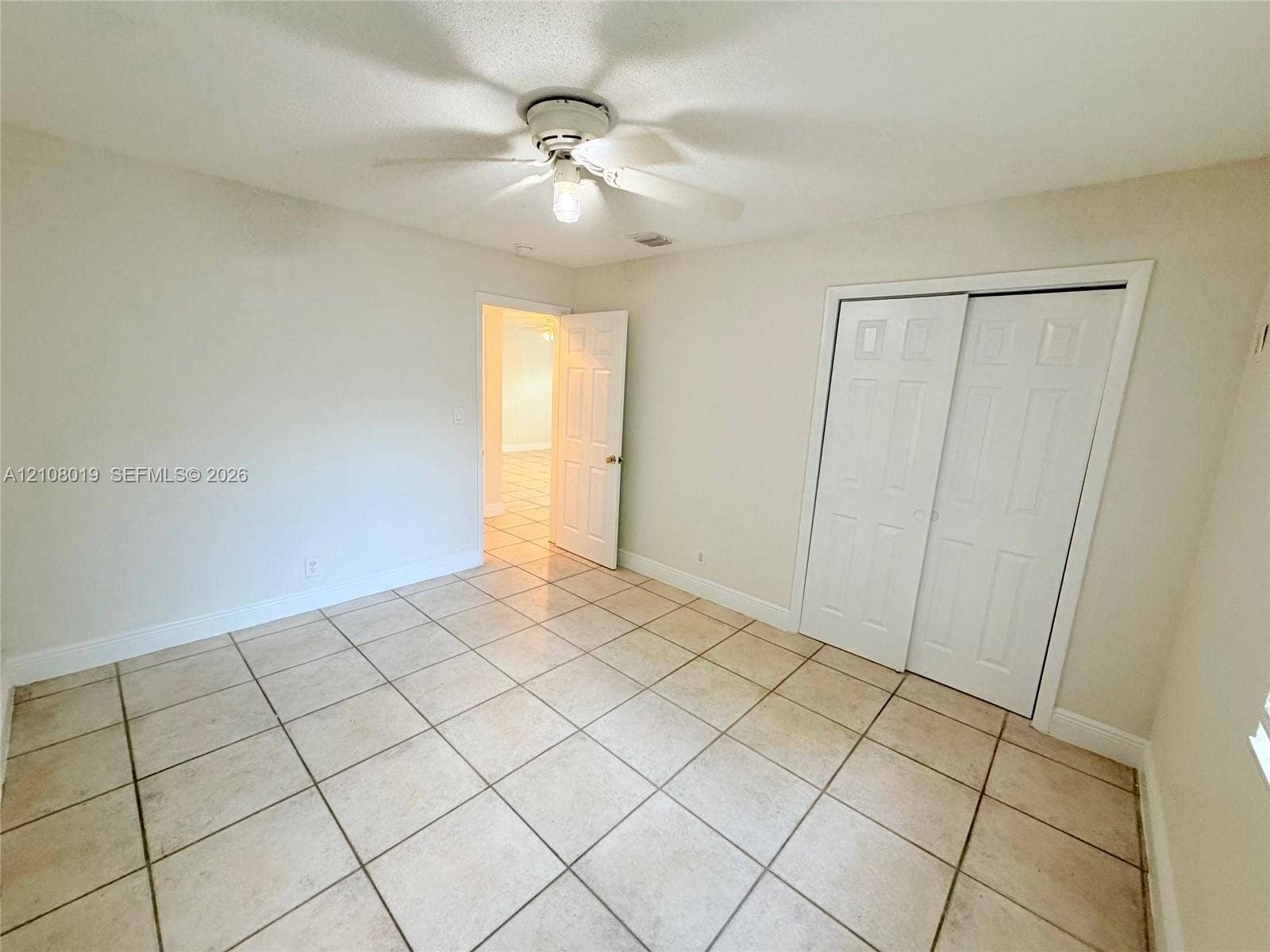 1105 NE 5th Terrace, #1-4, Fort Lauderdale, Fort Lauderdale, FL 33304 Ceramic tile flooring, ceiling fan with integrated lighting, and dual-panel closet doors