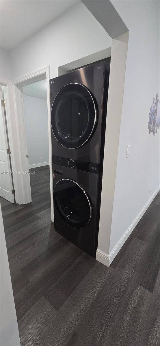 7176 SW 12th Street, #7176, Miami, Miami, FL 33144 Stackable laundry unit with black metallic finish and wood-finish flooring