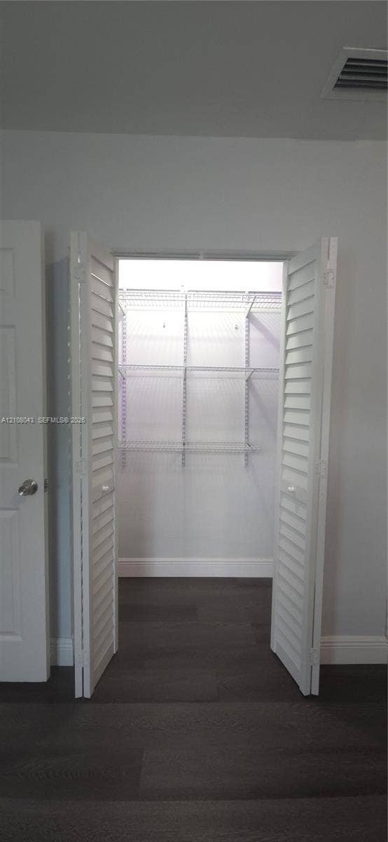 7176 SW 12th Street, #7176, Miami, Miami, FL 33144 Closet featuring white louvered bifold doors and integrated white wire shelving