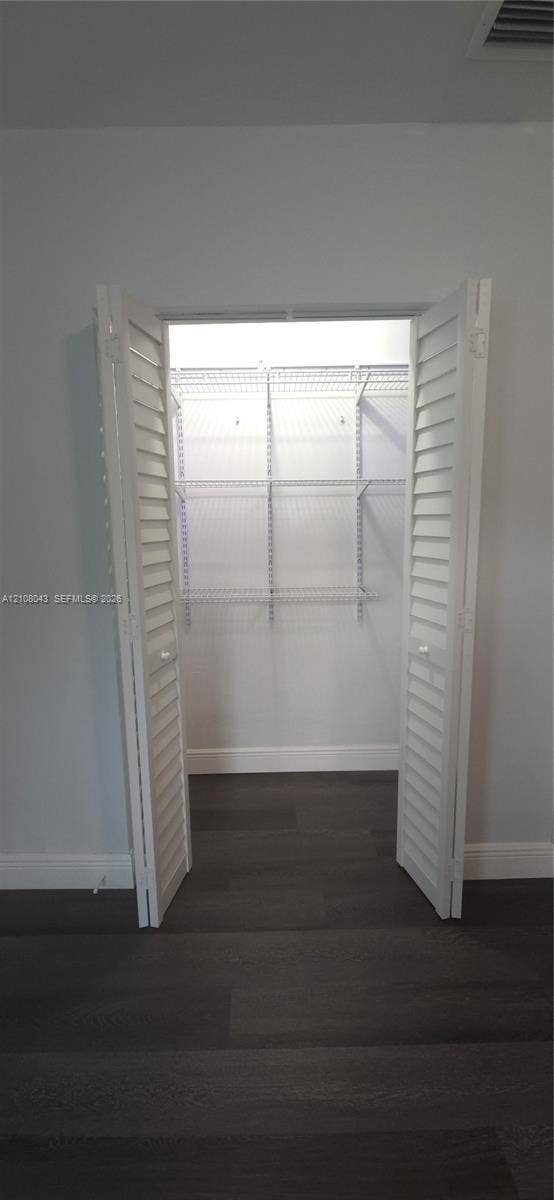 7176 SW 12th Street, #7176, Miami, Miami, FL 33144 Closet featuring white louvered doors and white wire shelving