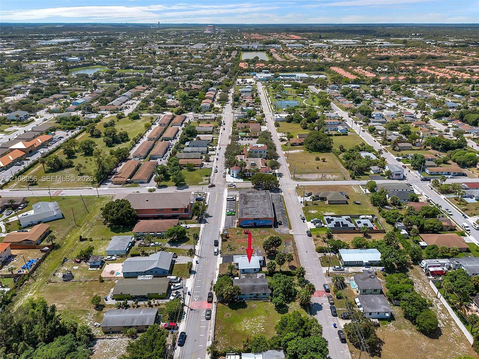 1444 W 28th Street, Riviera Beach, FL 33404 Aerial perspective highlighting a corner lot location with direct street access, proximity to commercial infrastructure, and established landscaping