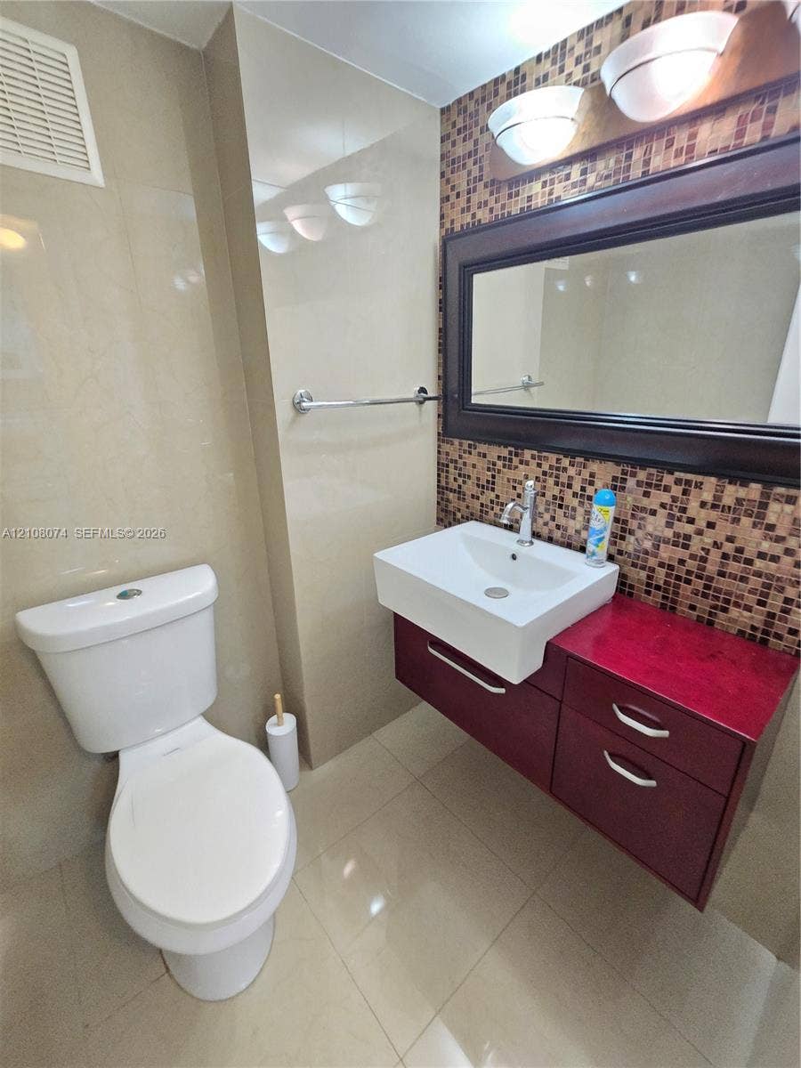 250 180th Drive, #202, Sunny Isles Beach, Sunny Isles Beach, FL 33160 Half bath for guests