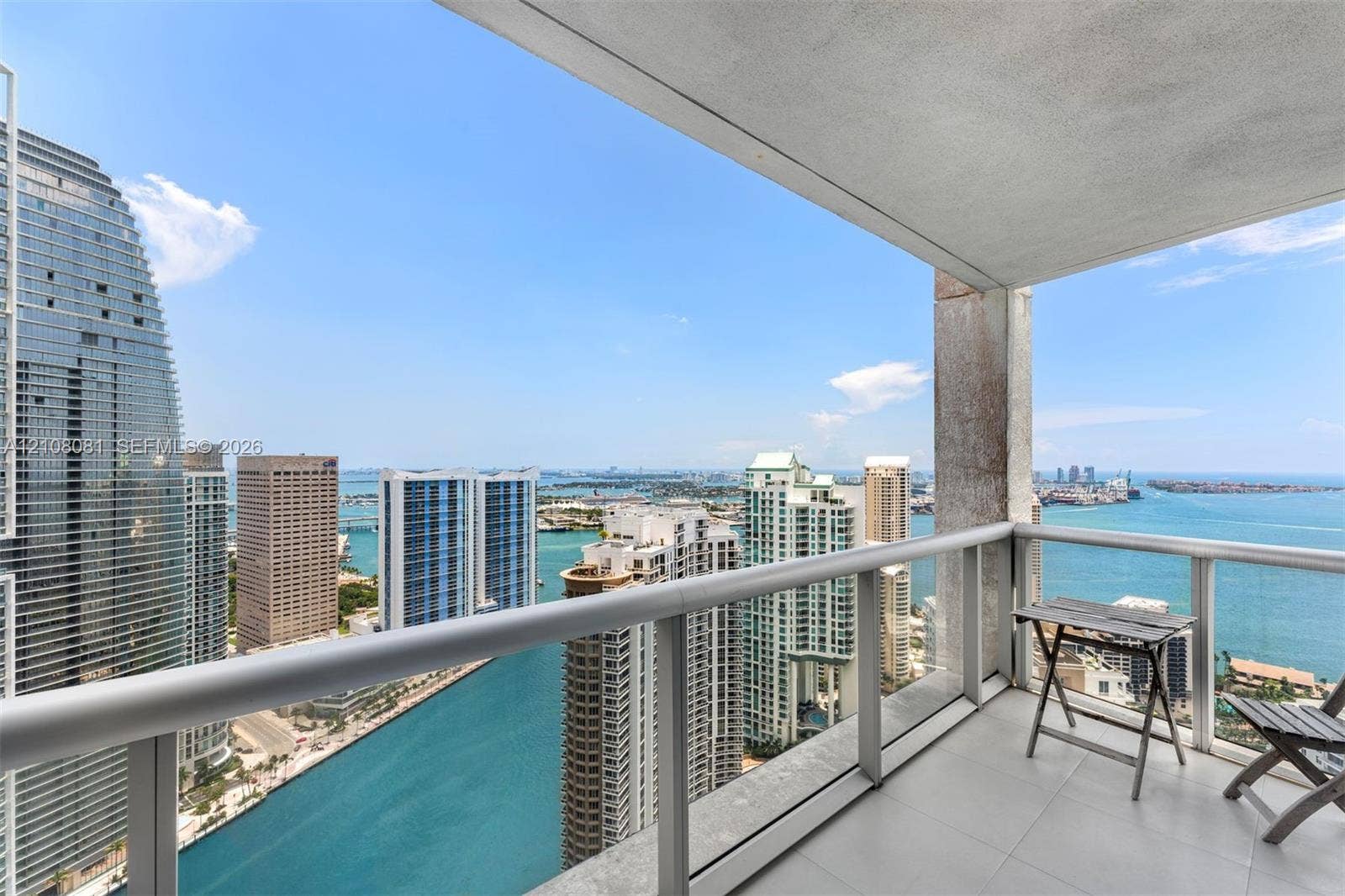 495 Brickell Avenue, #4502, Miami, FL 33131 Covered private balcony featuring tile flooring and a glass railing