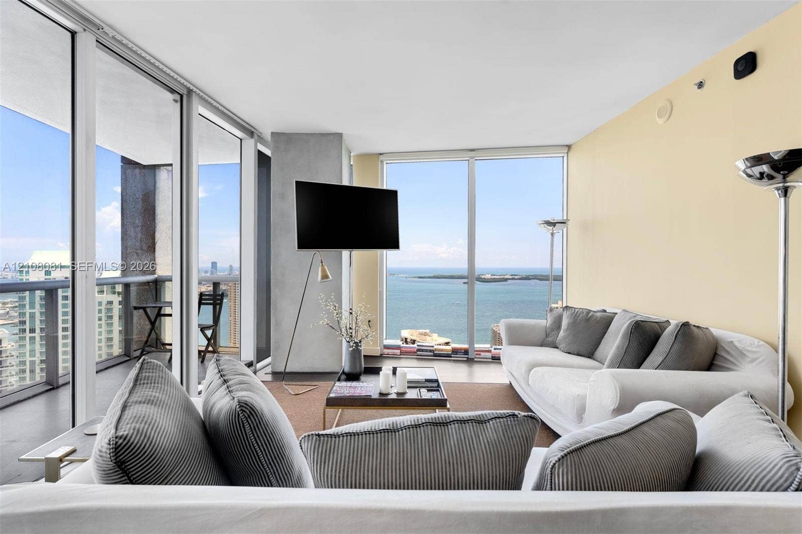495 Brickell Avenue, #4502, Miami, FL 33131 Floor-to-ceiling glass windows, private balcony, and polished concrete flooring