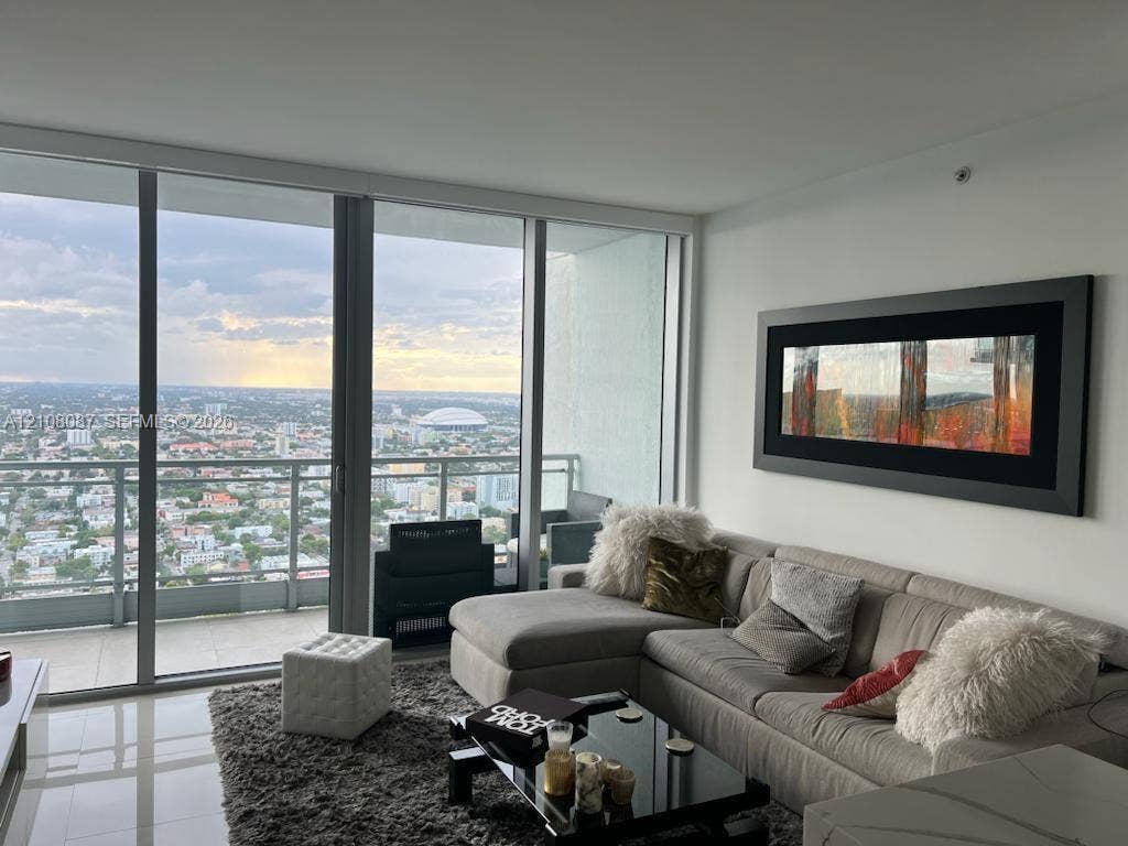 92 SW 3rd Street, #5008, Miami, Miami, FL 33130 Floor-to-ceiling windows, aluminum-frame sliding glass door, private balcony, and tile flooring