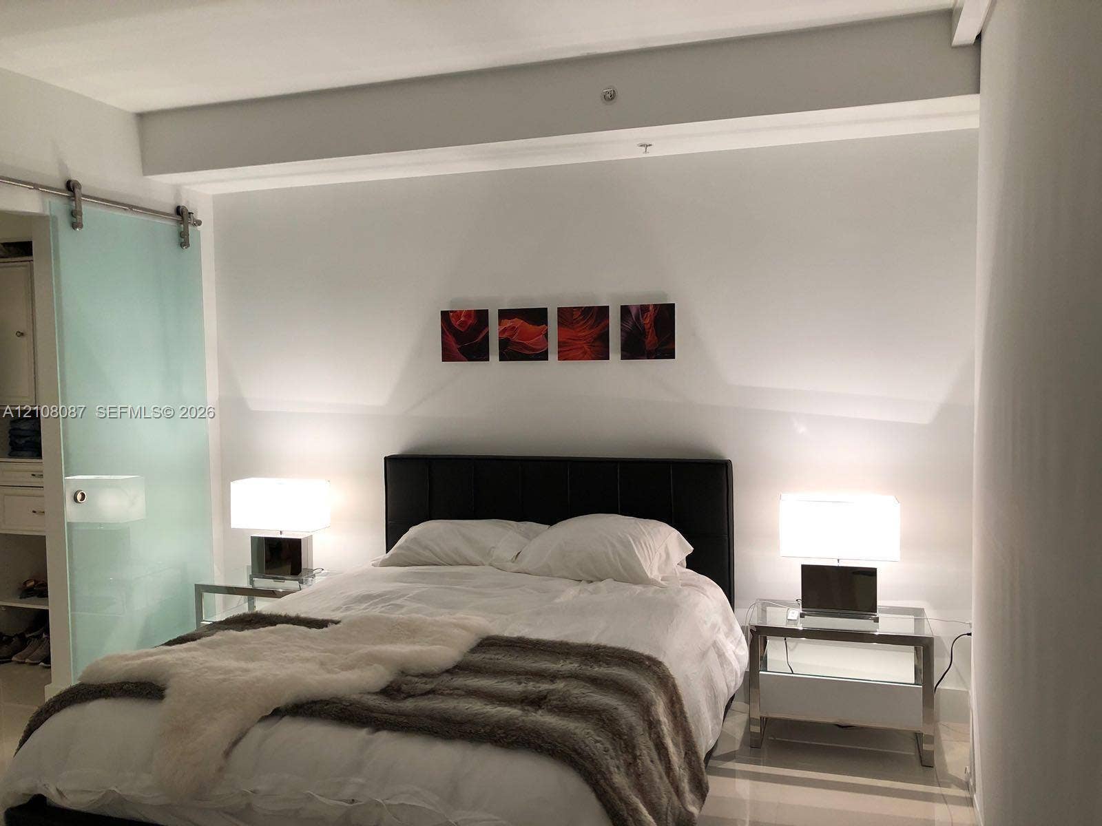 92 SW 3rd Street, #5008, Miami, Miami, FL 33130 Frosted glass sliding barn door with stainless steel hardware and polished tile flooring
